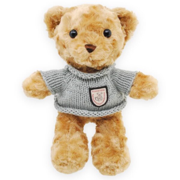 oso de peluche cafe sueter gris